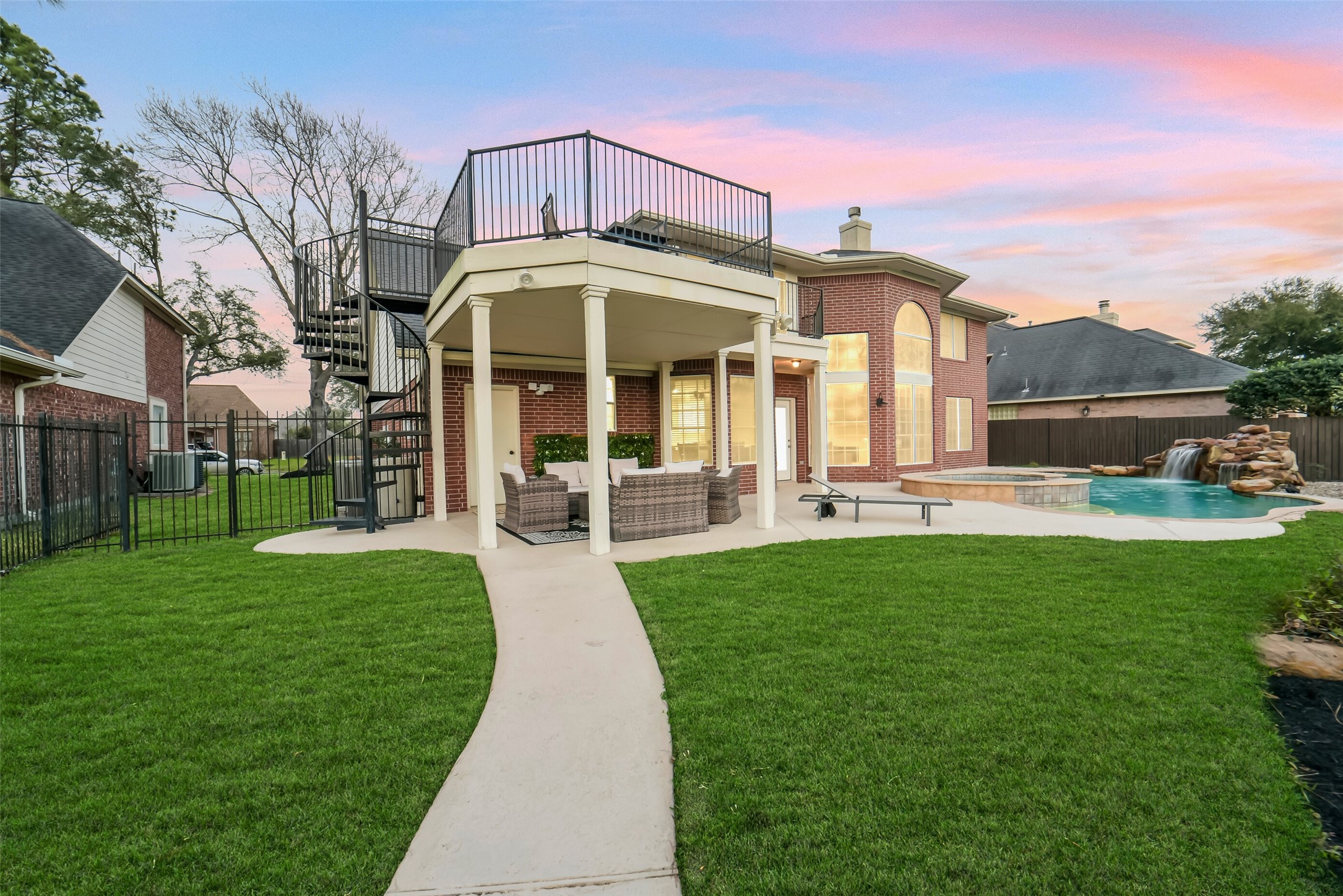 24403 Falcon Point Drive Katy, TX 77494 - Photo 28 of 32 Expansive backyard offering plenty of green space for play, gardening, or future custom additions.
