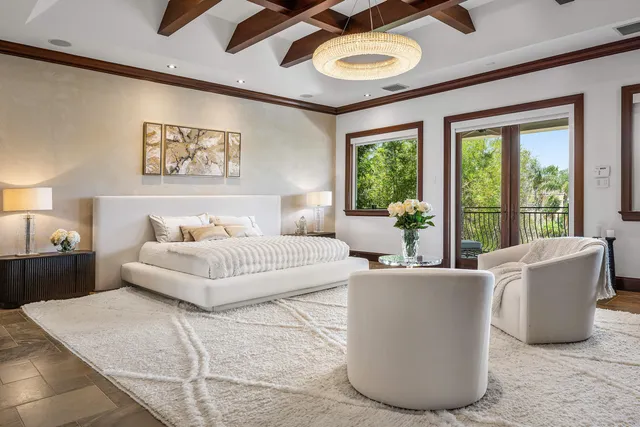 a room with fireplace furniture and a floor to ceiling window