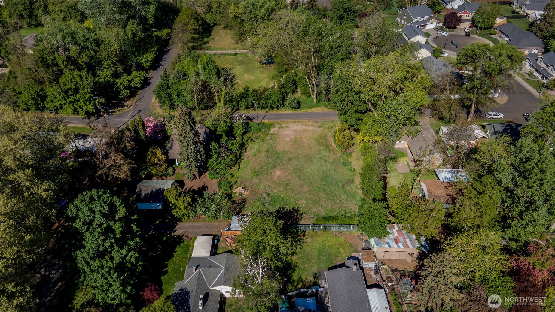 1031 Woodlawn Street Walla Walla, WA 99362 - Photo 7 of 7 an aerial view of a residential houses with outdoor space and trees all around