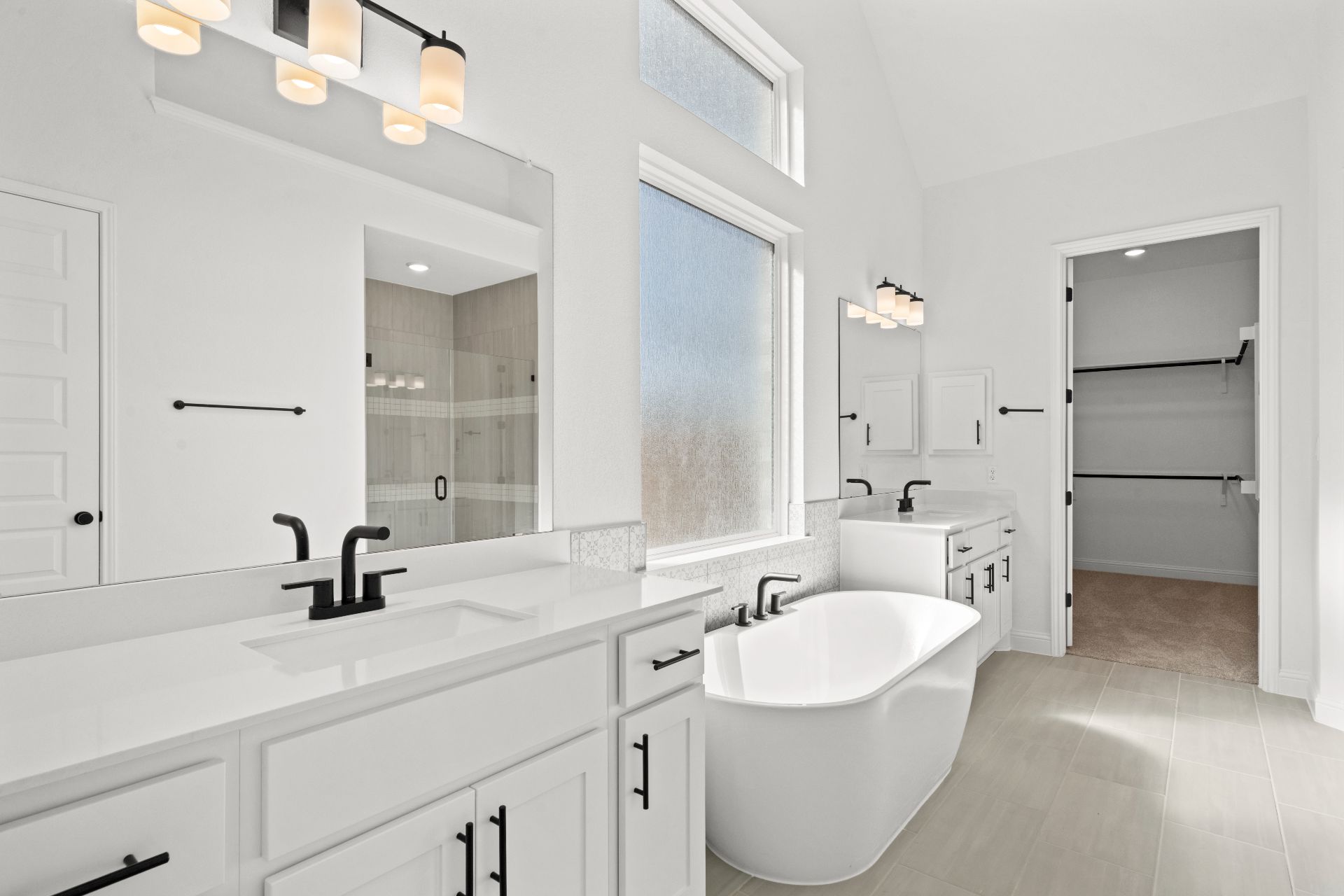 497 Wood Thrush Run Kyle, TX 78640 - Photo 17 of 35 Primary Bath retreat with dual vanities & soaking tub