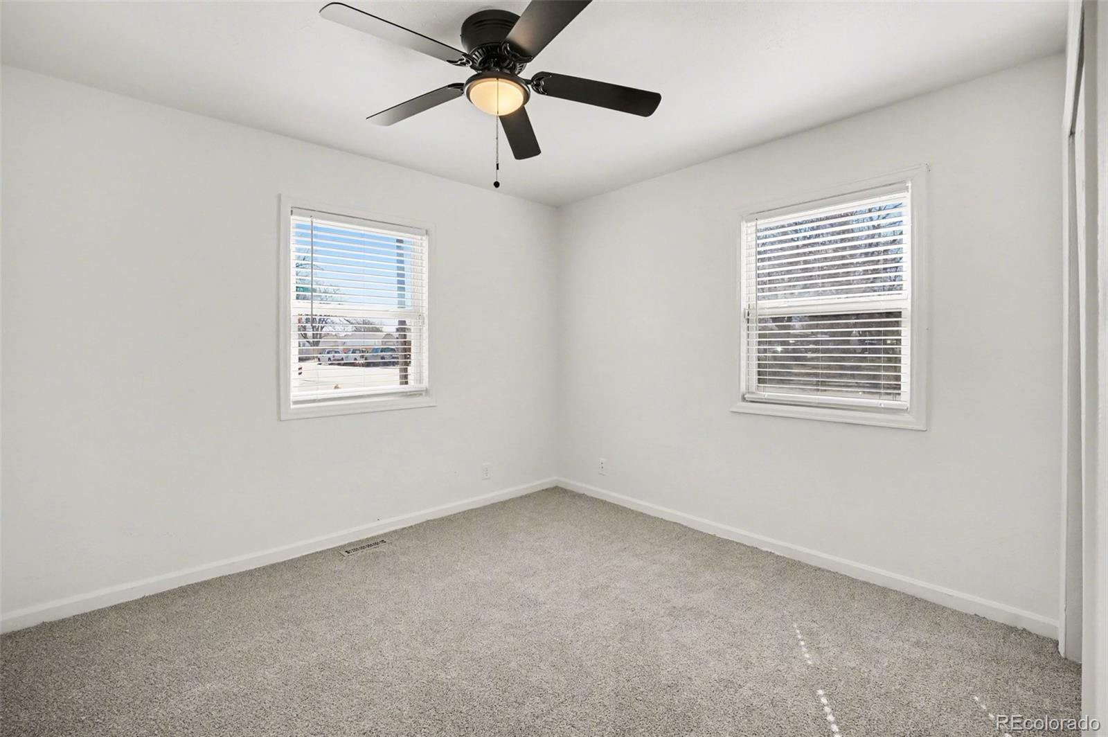1701 Ironton Street Aurora, CO 80010 - Photo 11 of 23 a view of an empty room with a window