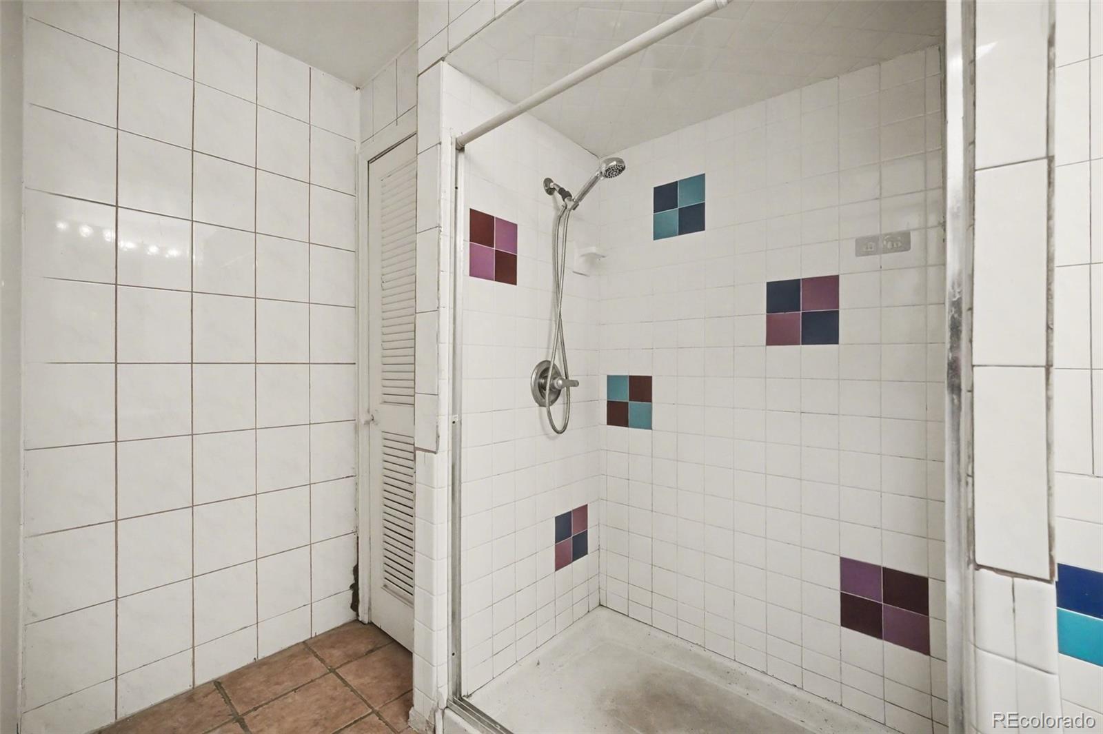 1701 Ironton Street Aurora, CO 80010 - Photo 15 of 23 a bathroom with a shower