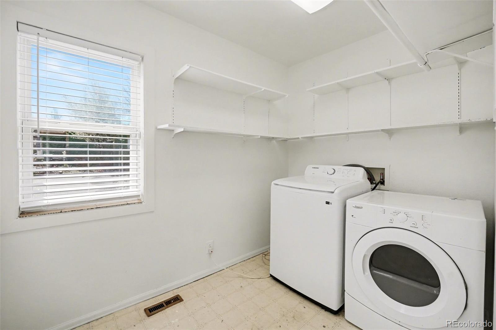 1701 Ironton Street Aurora, CO 80010 - Photo 17 of 23 a utility room with dryer and washer