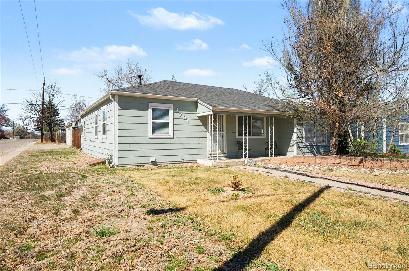 1701 Ironton Street Aurora, CO 80010 - Photo 3 of 23 a front view of a house with a yard