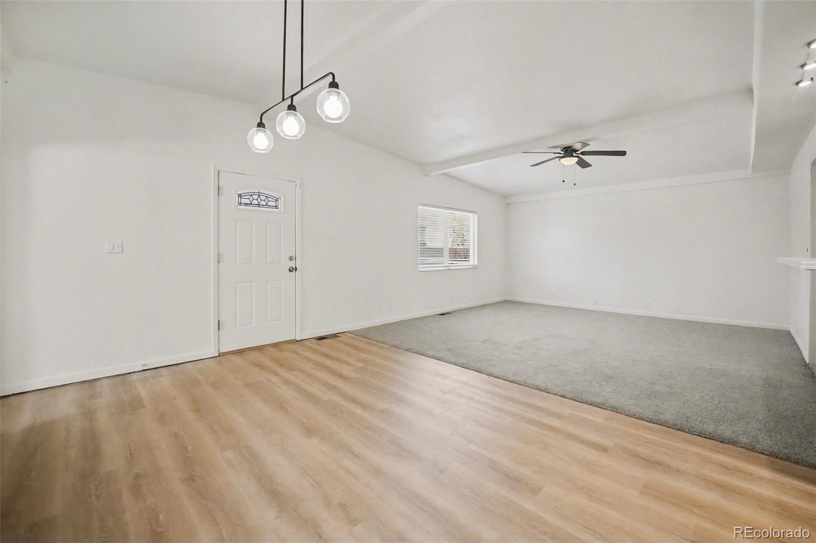 1701 Ironton Street Aurora, CO 80010 - Photo 4 of 23 a view of an empty room with windows