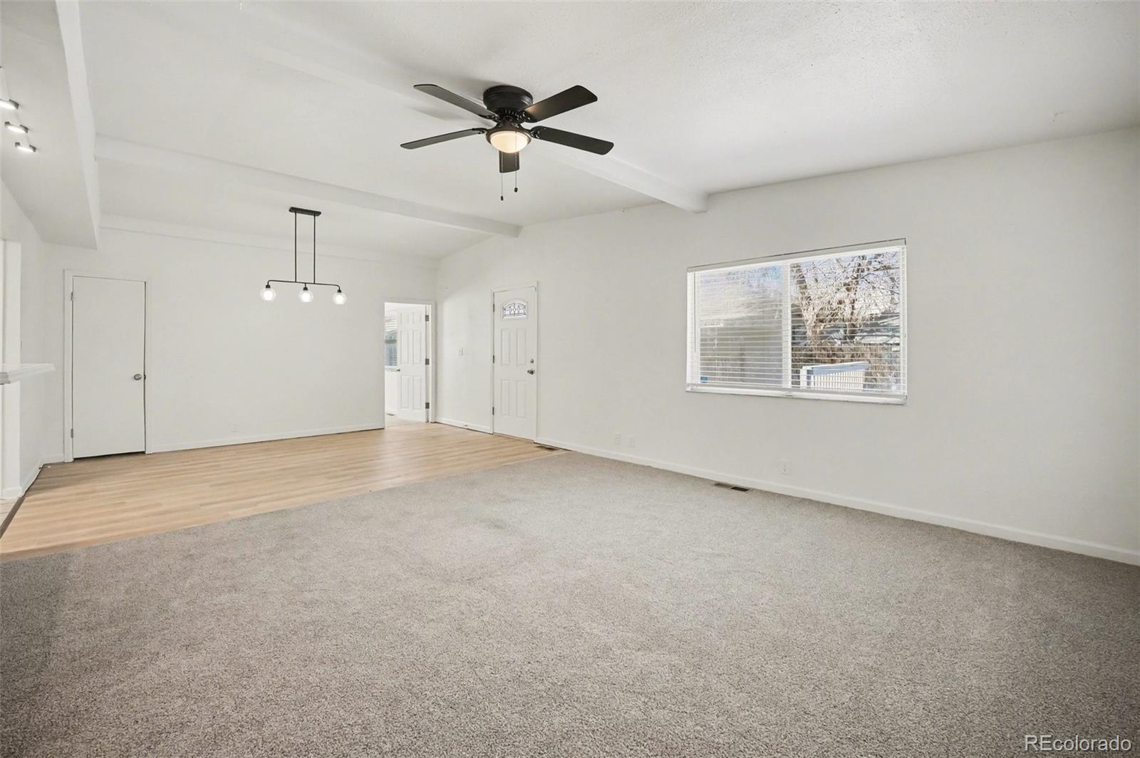 1701 Ironton Street Aurora, CO 80010 - Photo 6 of 23 a view of an empty room with a window