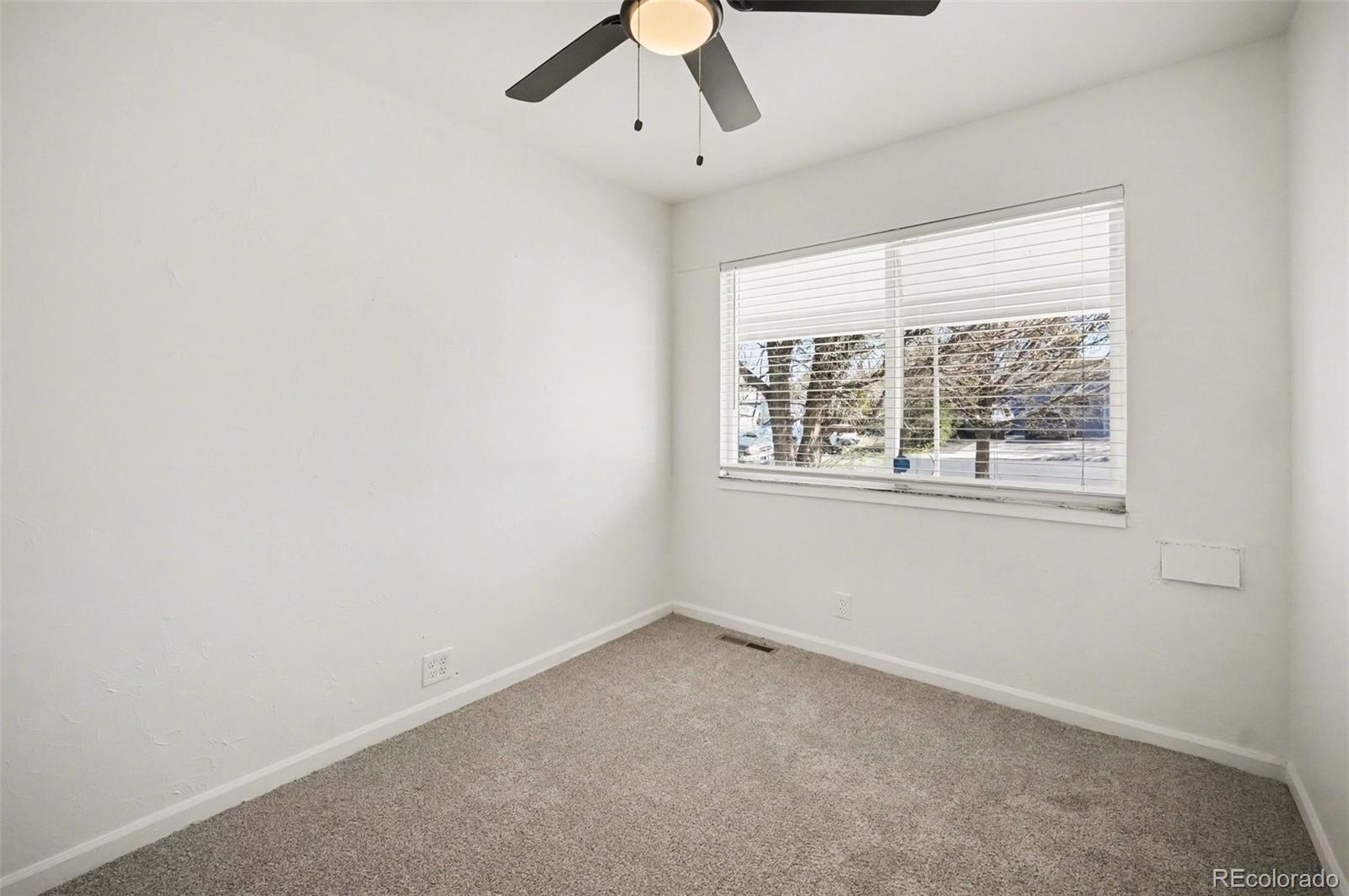1701 Ironton Street Aurora, CO 80010 - Photo 10 of 23 an empty room with a window