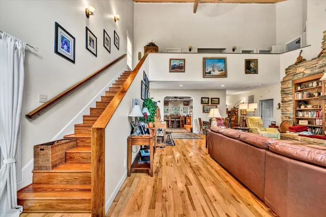 a living room with furniture and wooden floor