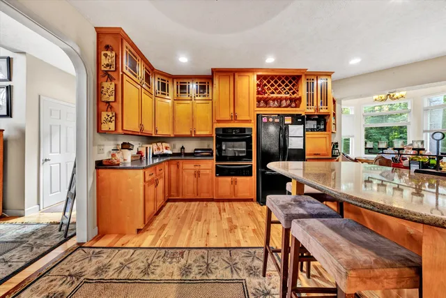 a view of a livingroom with furniture and a window
