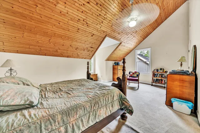 a view of living room with furniture and a potted plant