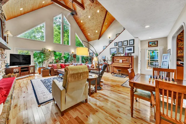 a view of living room kitchen and dining room