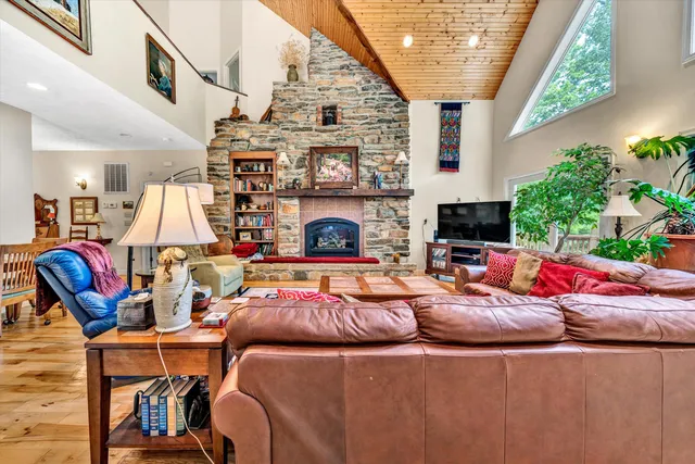 a outdoor living space with furniture and a fireplace