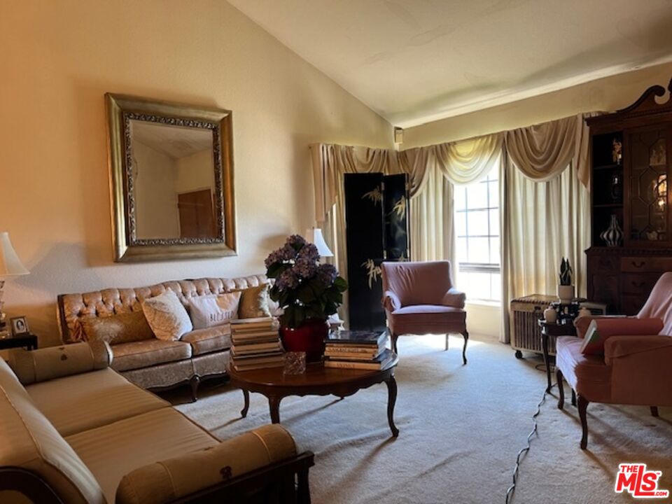 5259 West Goldenwood Drive Inglewood, CA 90302 - Photo 2 of 9 a living room with furniture and a large window