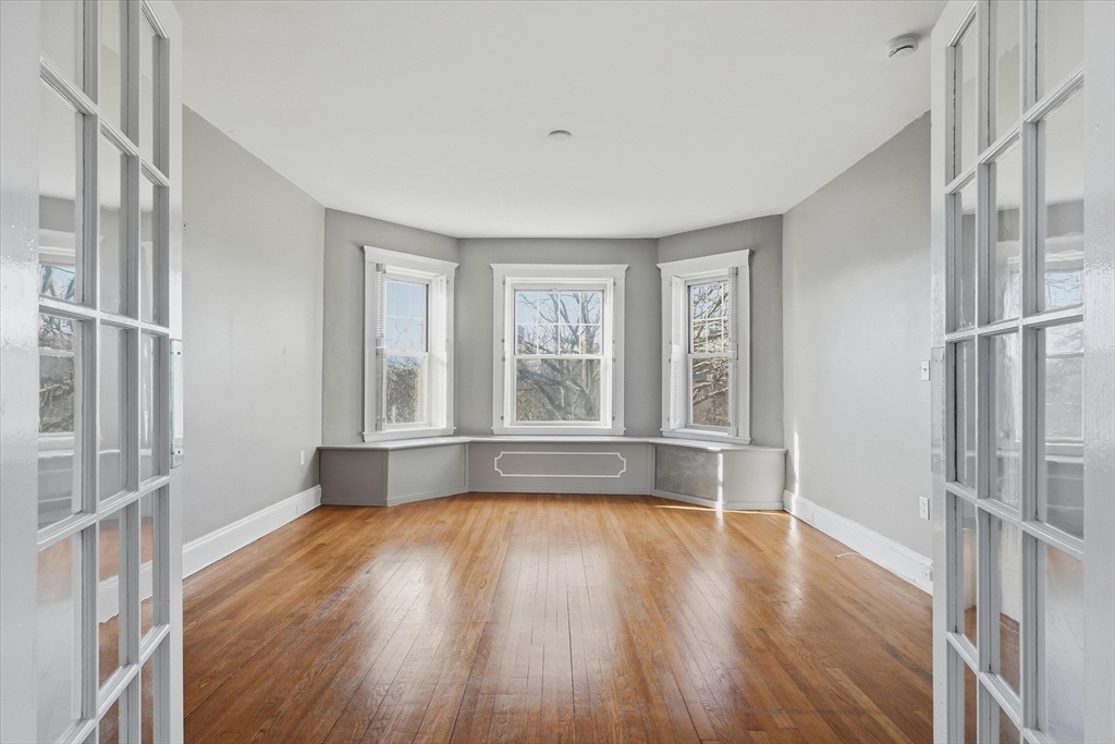 70 Fenway, Unit 51 Boston, MA 02115 - Photo 14 of 24 a view of empty room with wooden floor and fan