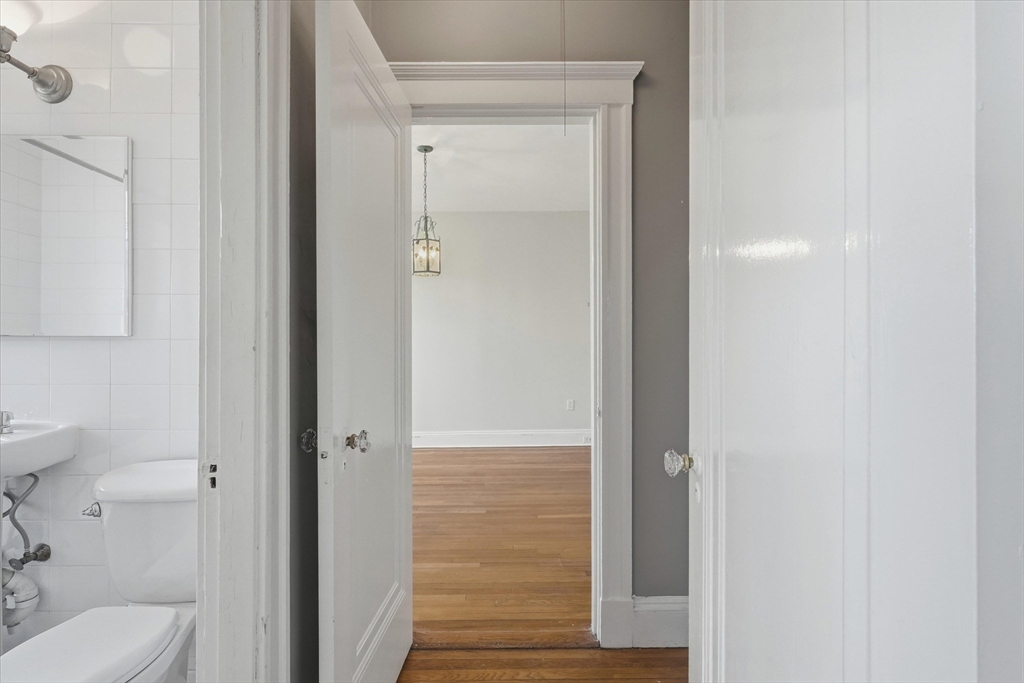70 Fenway, Unit 51 Boston, MA 02115 - Photo 17 of 24 a bathroom with a shower and a toilet