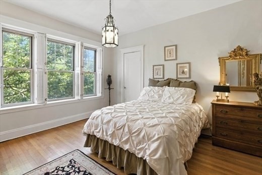 70 Fenway, Unit 51 Boston, MA 02115 - Photo 20 of 24 a bedroom with bed and window