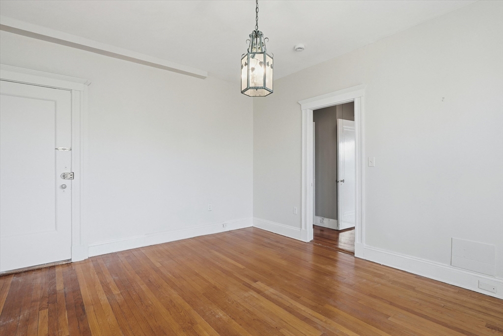 70 Fenway, Unit 51 Boston, MA 02115 - Photo 21 of 24 a view of empty room with wooden floor and fan
