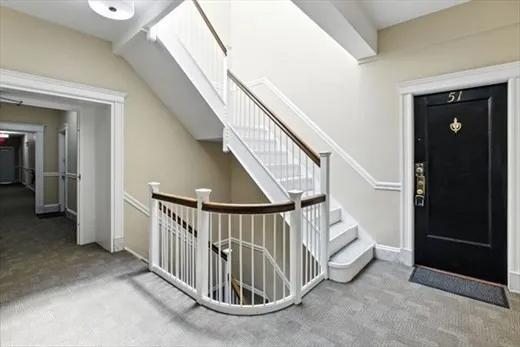 a view of wooden floor and windows in a room