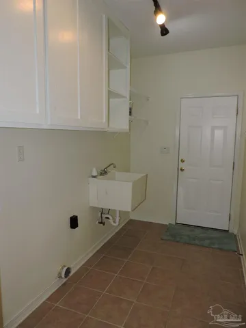 an empty room with a bench