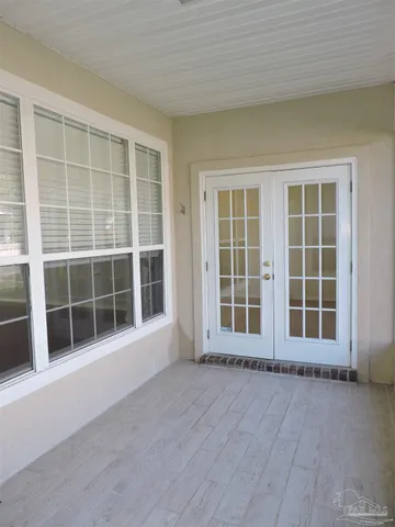 a view of an empty room with a large window