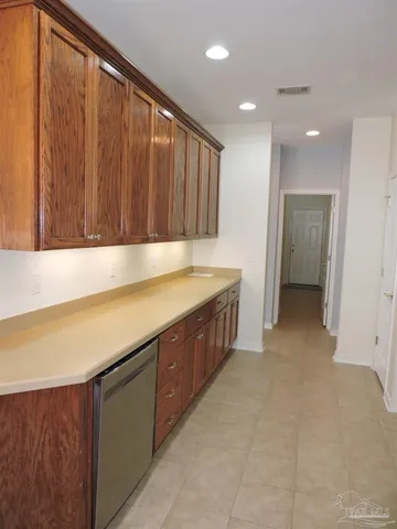 a kitchen with stainless steel appliances granite countertop a sink and a granite counter tops