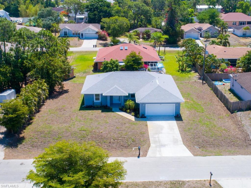 17385 Connecticut Road Fort Myers, FL 33967 - Photo 4 of 31 an aerial view of a house with yard swimming pool and outdoor seating