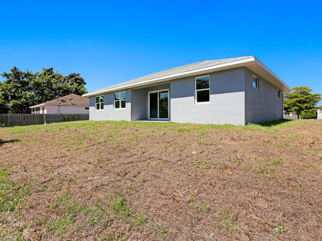 17385 Connecticut Road Fort Myers, FL 33967 - Photo 9 of 31 a house with yard in front of it