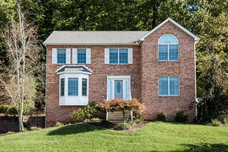 Brick front home situated in the sought after community of Treesdale.