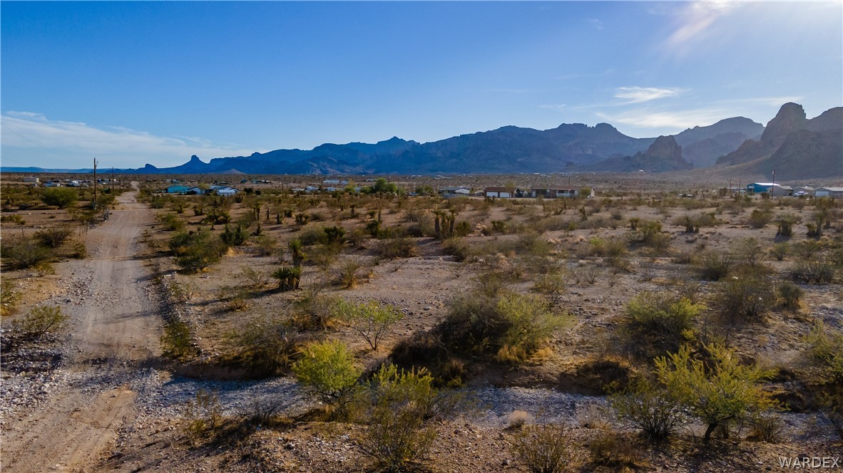 2693 Naco Road Golden Valley, AZ 86413 - Photo 14 of 17 a view of a lush green hillside and a houses