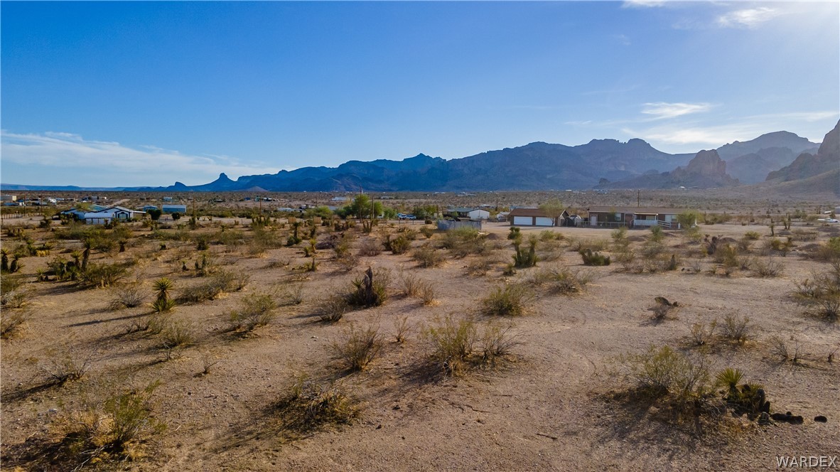 2693 Naco Road Golden Valley, AZ 86413 - Photo 17 of 17 a view of a lake with mountains in the background
