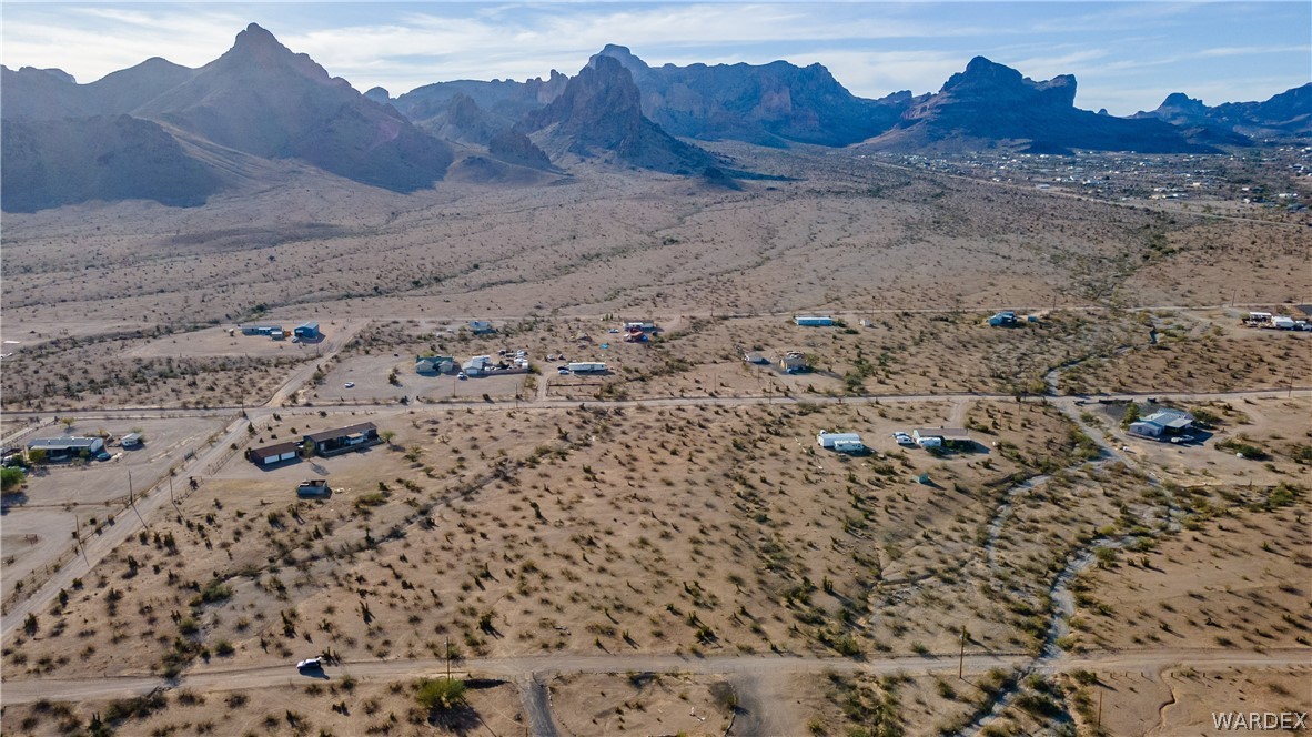 2693 Naco Road Golden Valley, AZ 86413 - Photo 3 of 17 a view of a dry field with mountains in the background