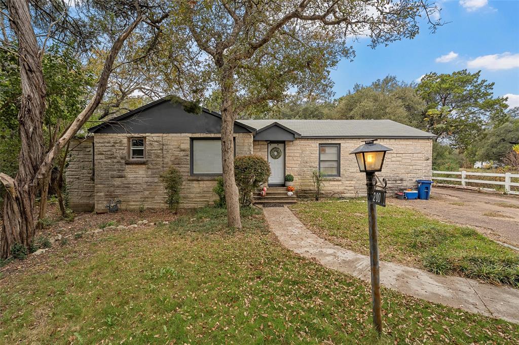 View of front of property featuring stone siding