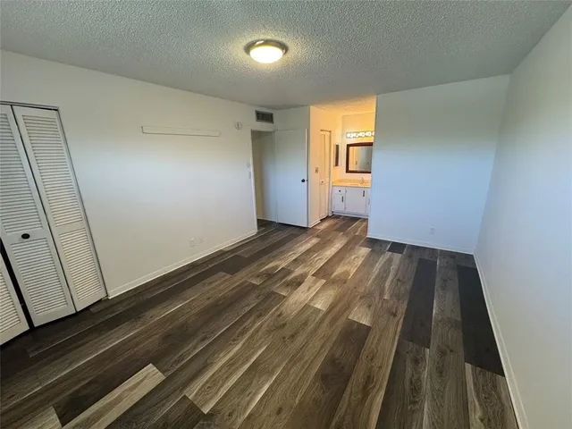 a view of wooden floor in an empty room
