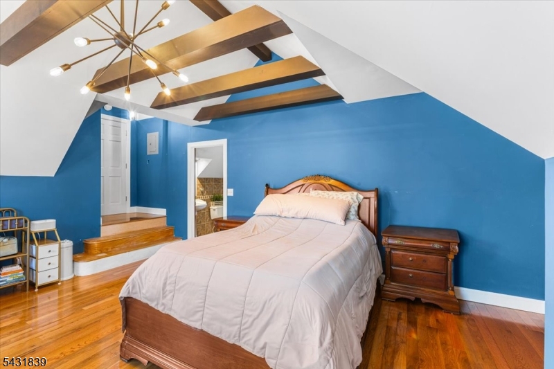 15 Spring Hunter Court Andover, NJ 07821 - Photo 35 of 49 a bedroom with a bed and a ceiling fan