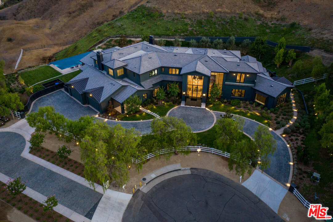 25211 Jim Bridger Road Hidden Hills, CA 91302 - Photo 2 of 42 an aerial view of a house with garden space and street view