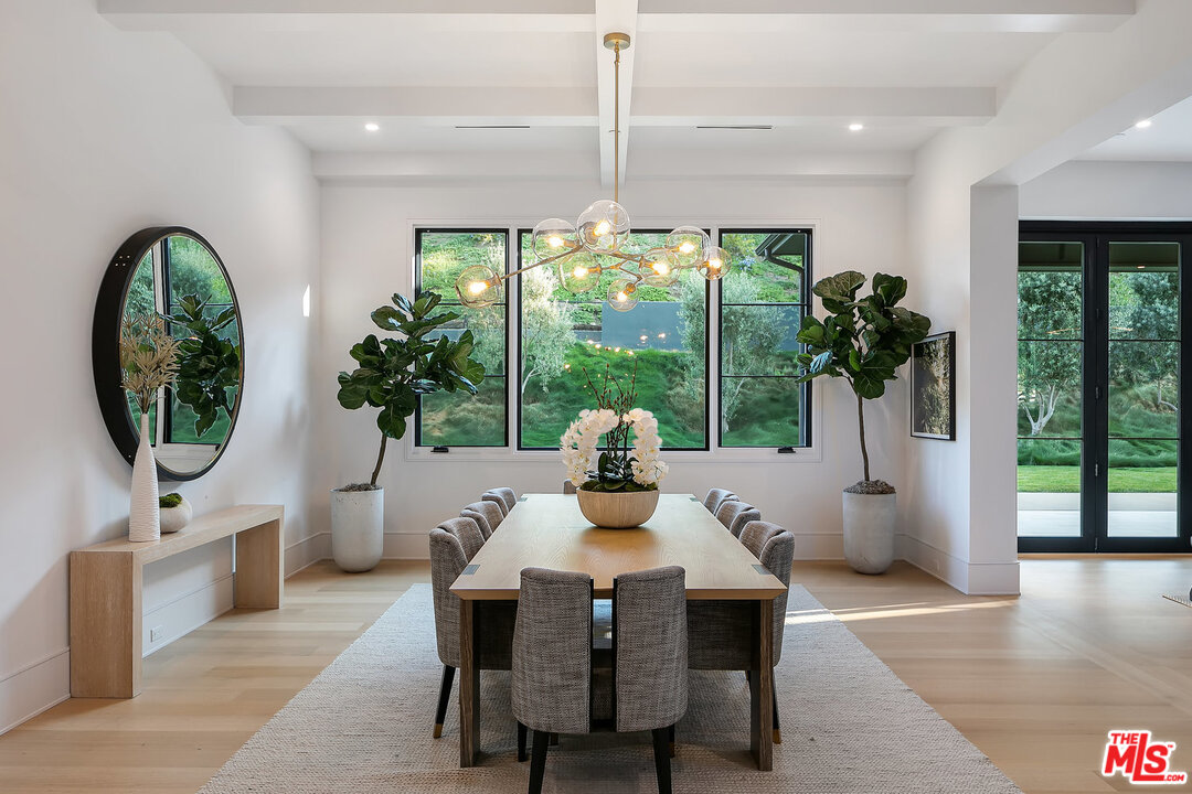 25211 Jim Bridger Road Hidden Hills, CA 91302 - Photo 12 of 42 a view of a dining room with furniture window and outside view
