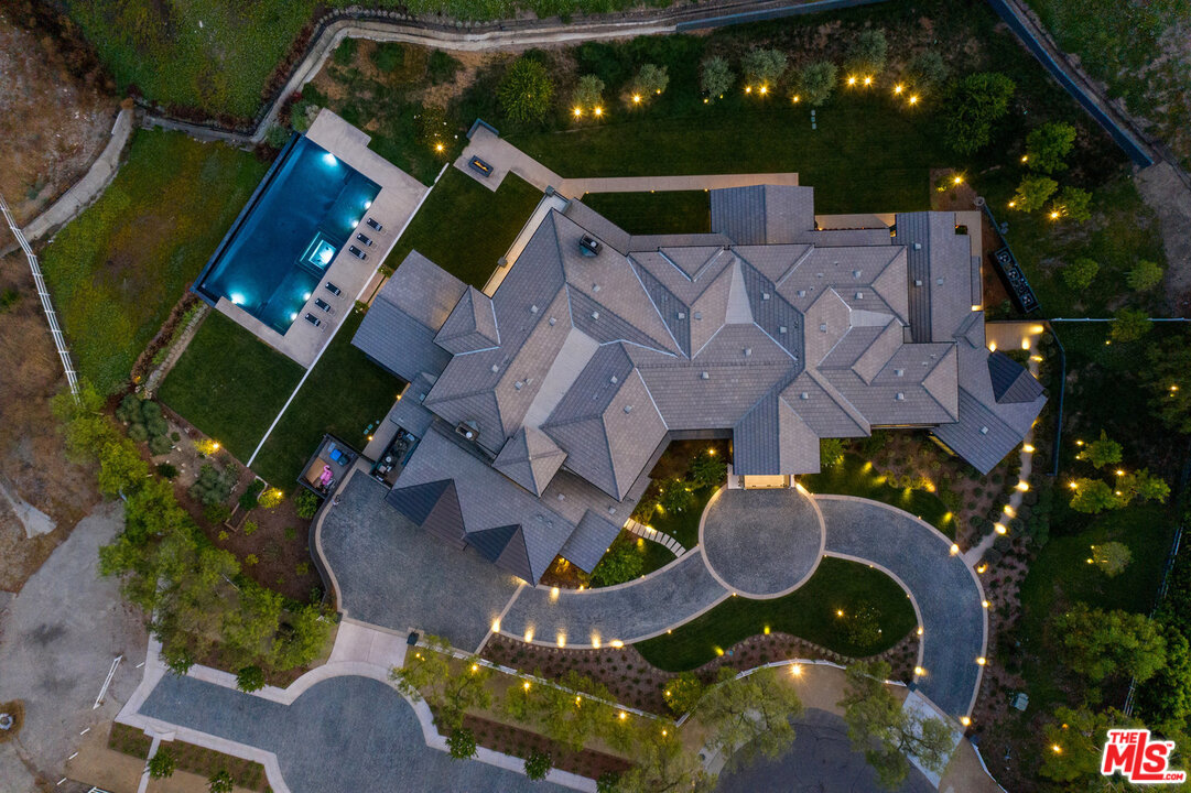 25211 Jim Bridger Road Hidden Hills, CA 91302 - Photo 3 of 42 an aerial view of house with yard swimming pool and outdoor seating
