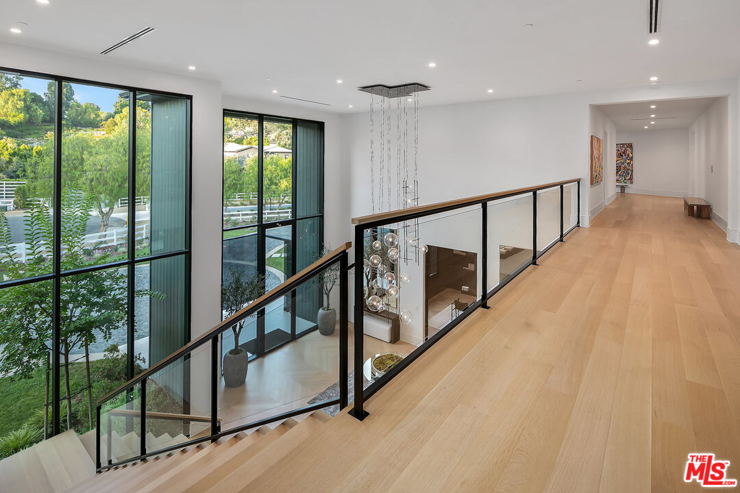 25211 Jim Bridger Road Hidden Hills, CA 91302 - Photo 23 of 42 a view of an entryway with wooden floor