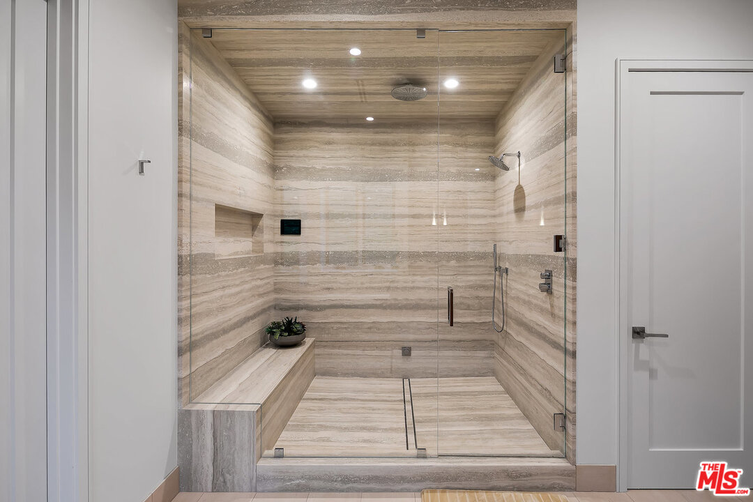 25211 Jim Bridger Road Hidden Hills, CA 91302 - Photo 32 of 42 a bathroom with a shower