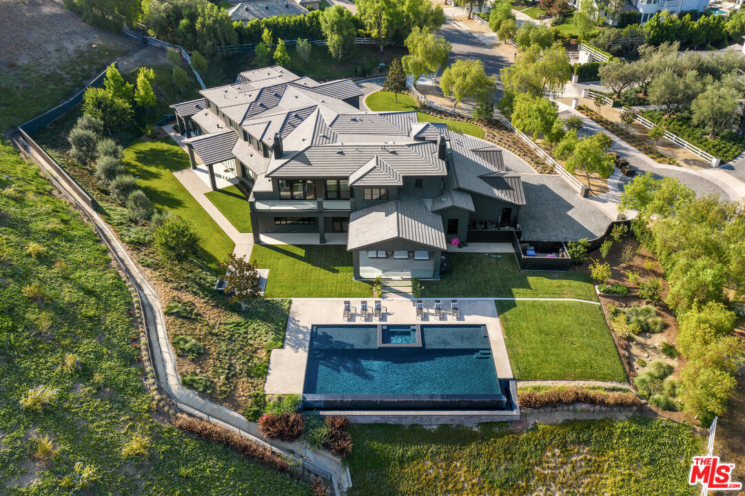 25211 Jim Bridger Road Hidden Hills, CA 91302 - Photo 41 of 42 an aerial view of a house with garden space sitting space and swimming pool