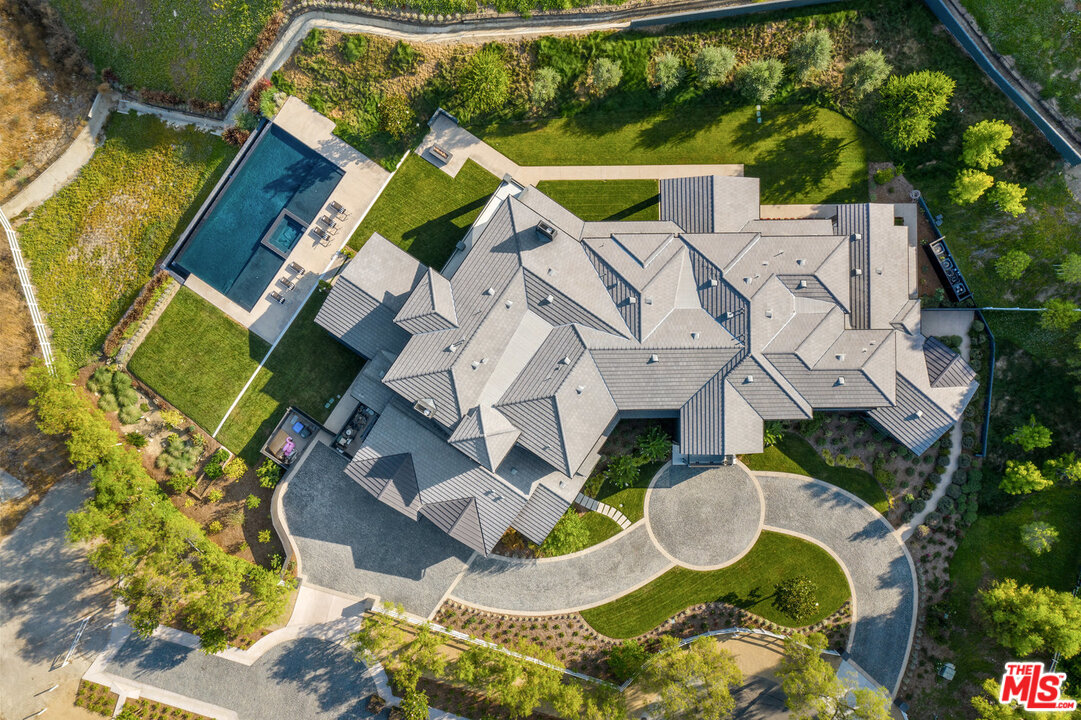 25211 Jim Bridger Road Hidden Hills, CA 91302 - Photo 42 of 42 an aerial view of residential house with outdoor space and swimming pool
