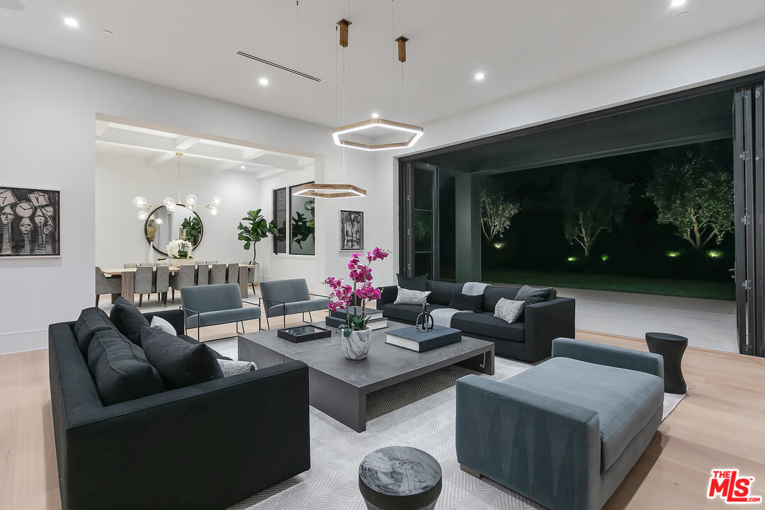 25211 Jim Bridger Road Hidden Hills, CA 91302 - Photo 9 of 42 a living room with furniture and a large window