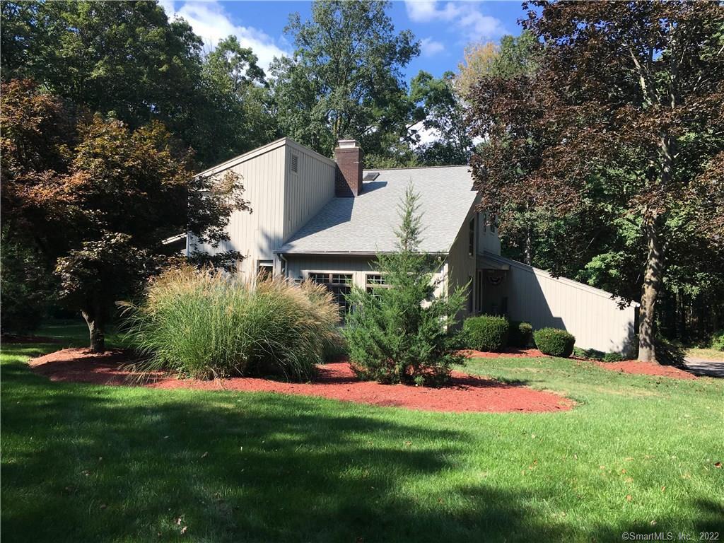 60 Ledgewood Road Redding, CT 06896 - Photo 1 of 1 a view of a white house with a yard and plants