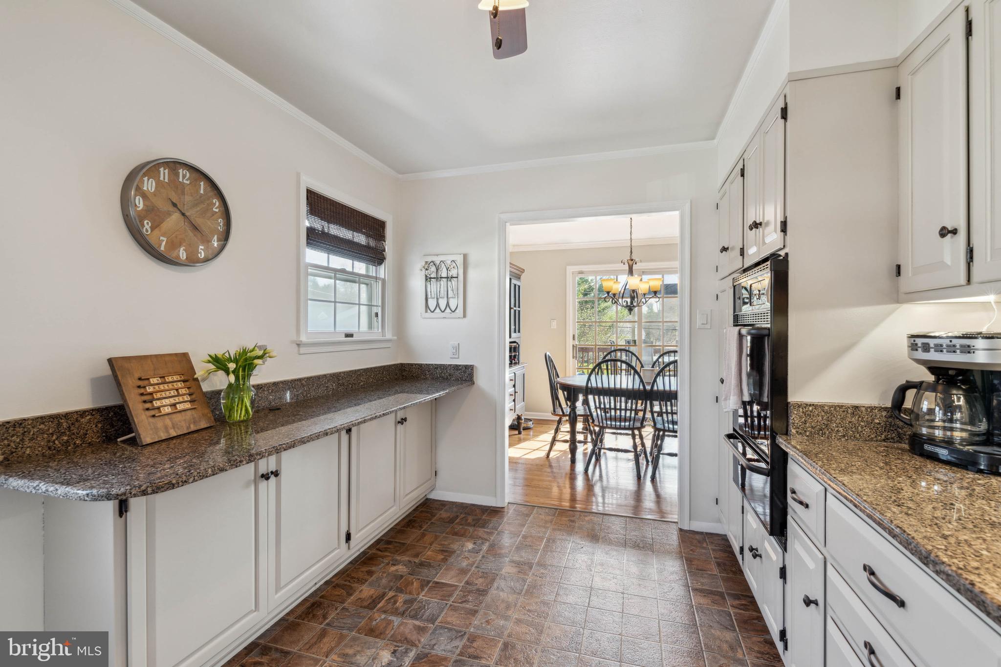 406 Bryanstone Road Owings Mills, MD 21117 - Photo 5 of 36 Kitchen Adjacent to Dining Room w/ Access to Deck