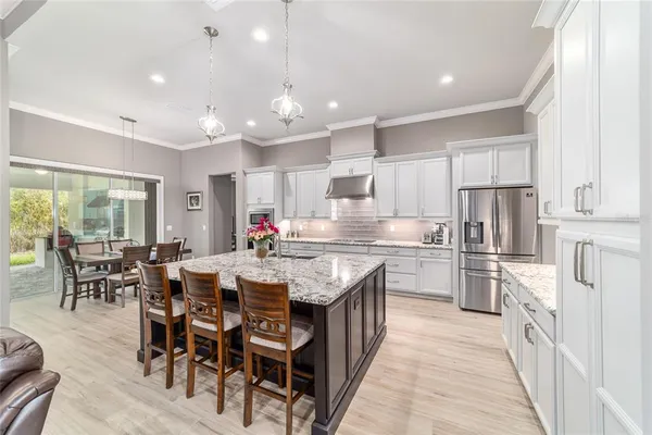 a kitchen with stainless steel appliances granite countertop lots of counter top space