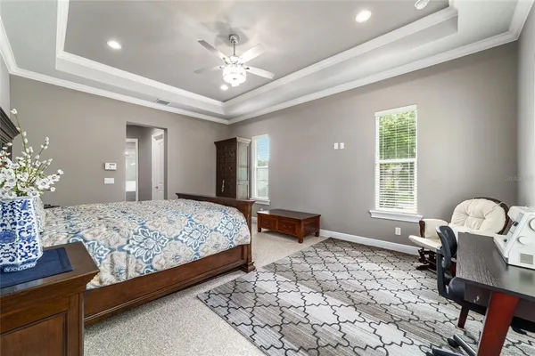 a living room with a mirror and dresser