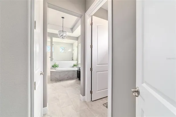 a white toilet sitting next to a shower