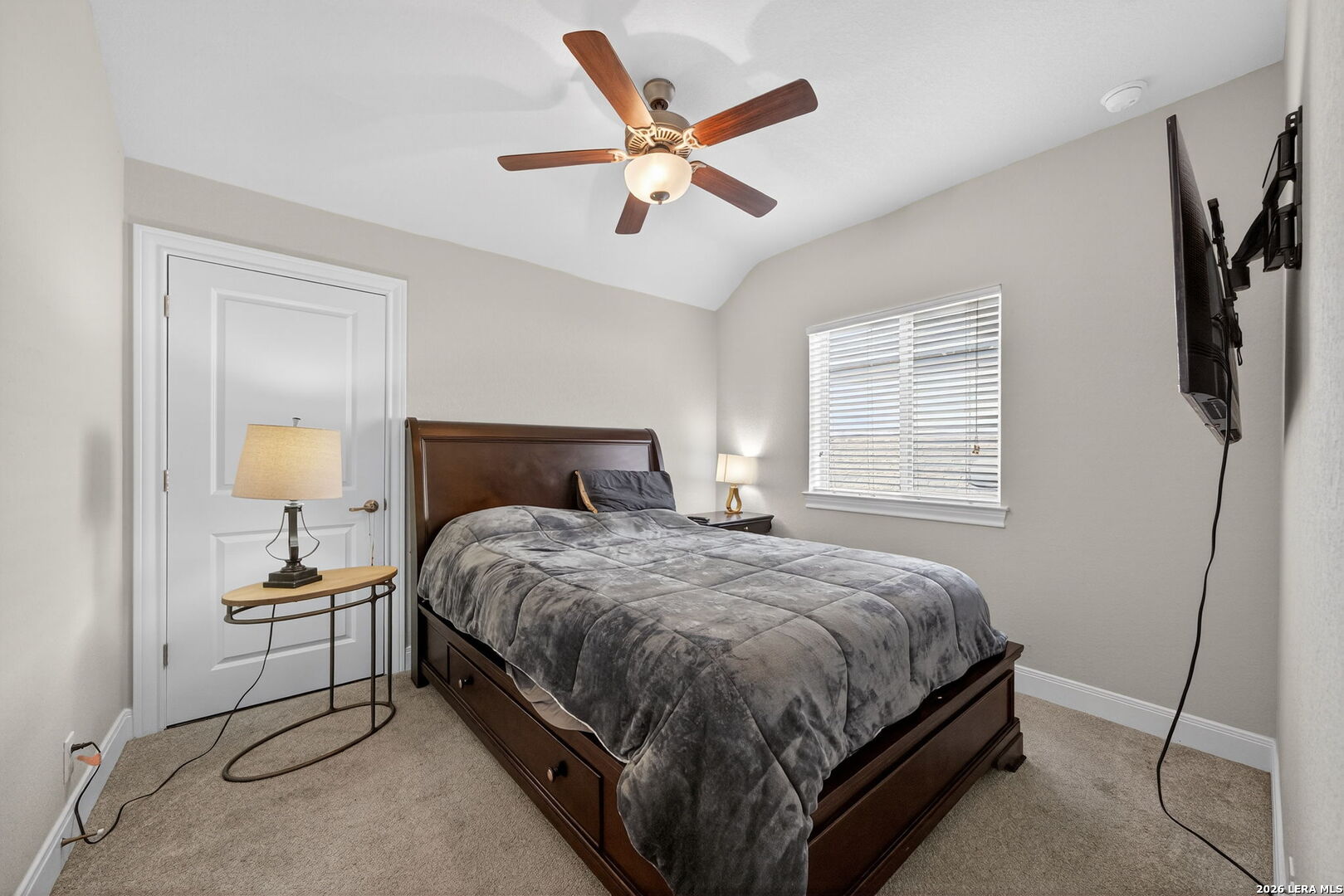 11202 Vance Jackson Road, Unit 17 San Antonio, TX 78230 - Photo 17 of 19 a bedroom with a bed and window