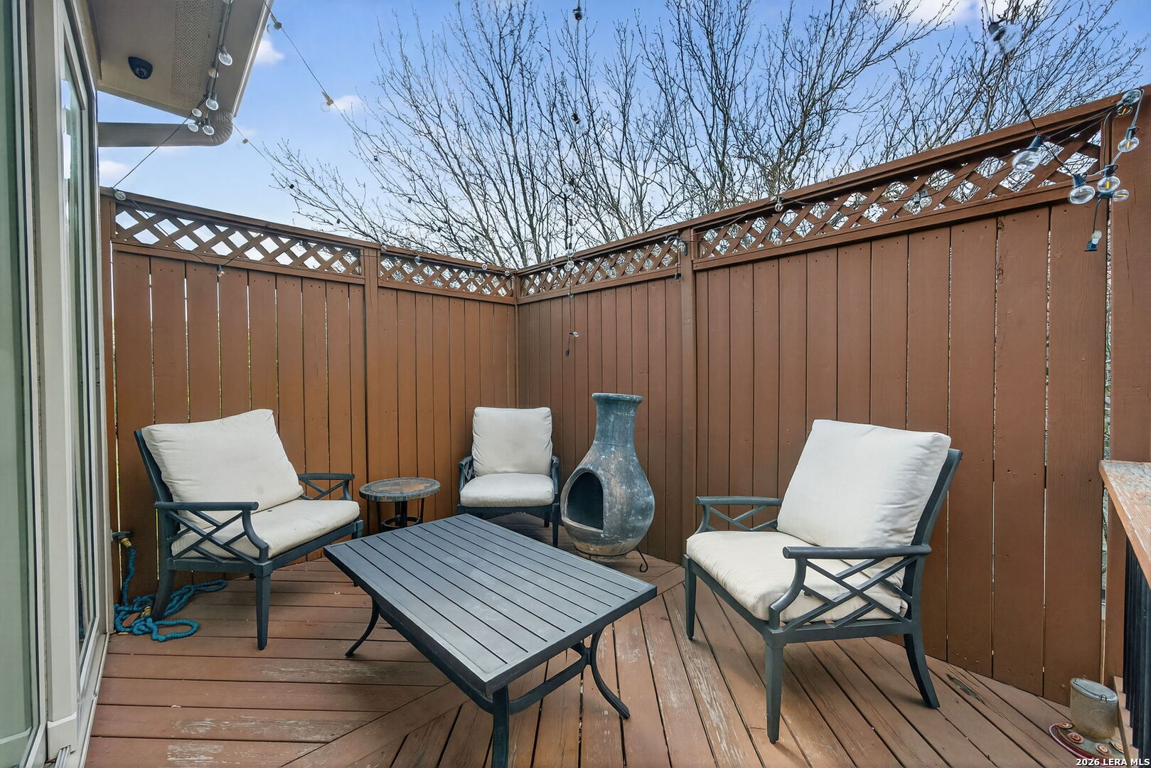 11202 Vance Jackson Road, Unit 17 San Antonio, TX 78230 - Photo 19 of 19 a balcony with wooden benches sitting on top of it