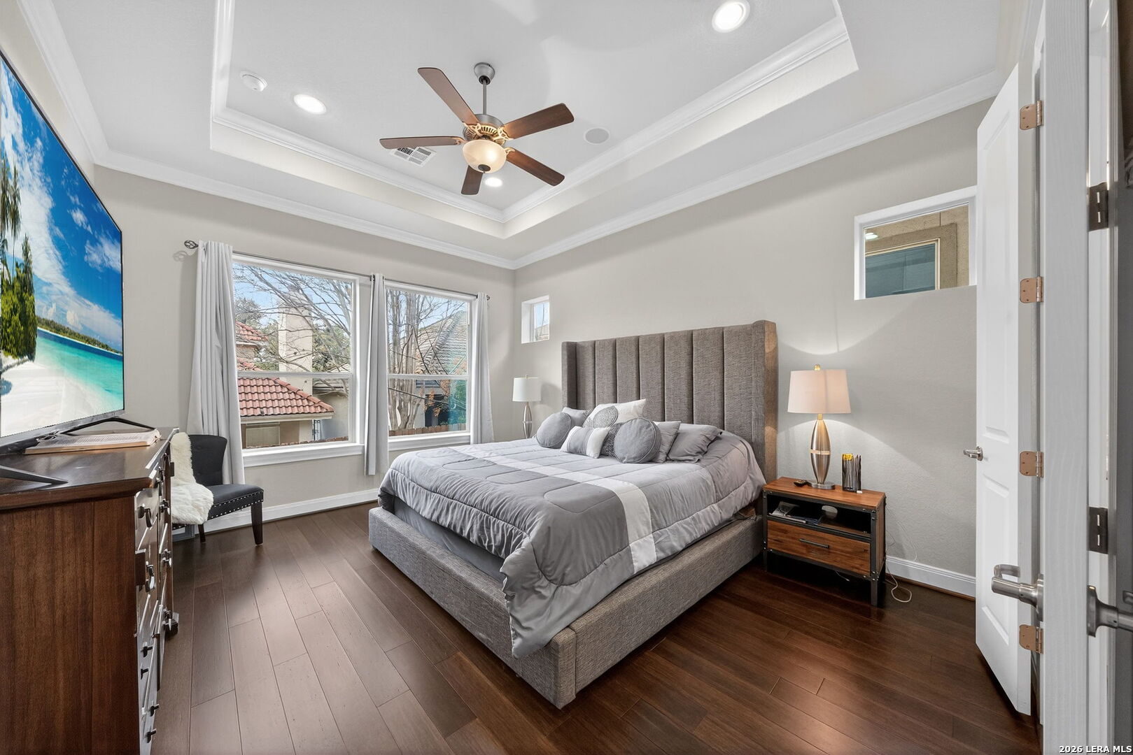 11202 Vance Jackson Road, Unit 17 San Antonio, TX 78230 - Photo 10 of 19 a bedroom with a bed and a large window